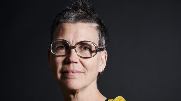 Portrait of Astrida Neimanis against a black baclground.