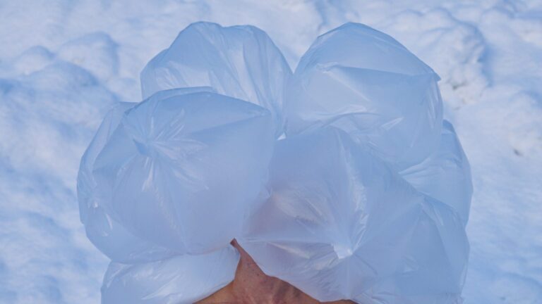 Dancer with thin plastic bags covering her head