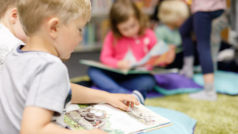 Children reading books in the Nordic Culture Point's library.