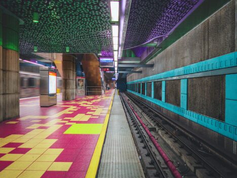 Subway station decorated with tiles and lights in bright colors