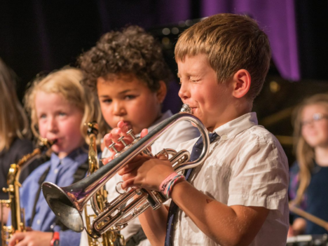 Kids playing jazz instruments.