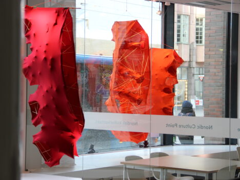 Artwork by Pia Männikkö in the window of Nordic Culture Point